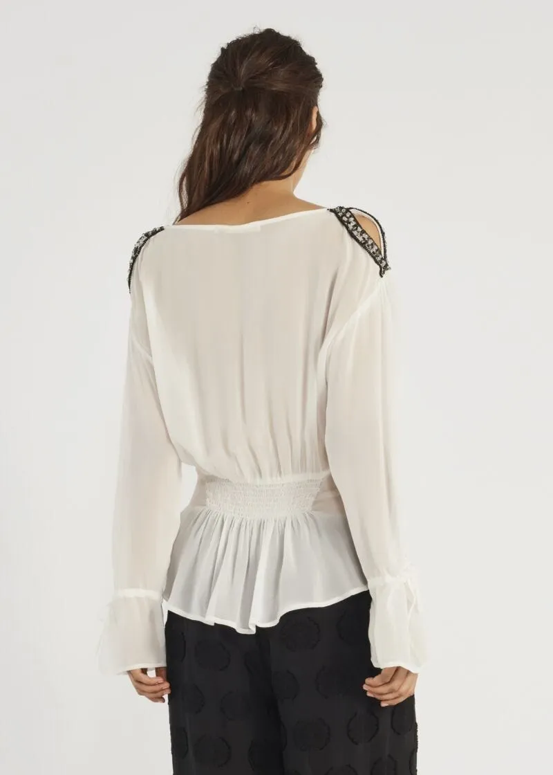 Blusa con peplo